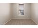 Carpeted bedroom with a large window and light neutral paint at 9423 E Posada Ave, Mesa, AZ 85212