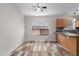 Inviting dining area with hardwood floors, a large window, and easy access to the kitchen at 9423 E Posada Ave, Mesa, AZ 85212