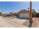 Single story home with desert landscaping and a low-pitched tile roof at 9423 E Posada Ave, Mesa, AZ 85212