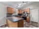 Well-equipped kitchen featuring oak cabinetry, modern appliances, and tile backsplash, perfect for cooking and entertaining at 9423 E Posada Ave, Mesa, AZ 85212