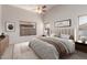 Staged bedroom with furniture, decorations, and natural light provides a peaceful and stylish sanctuary at 9423 E Posada Ave, Mesa, AZ 85212