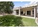 A lush lawn complements this single-story home with a covered patio at 10721 E Pampa Ave, Mesa, AZ 85212