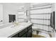 Clean bathroom design with a modern vanity, stylish mirror, and a shower with a decorative shower curtain at 10721 E Pampa Ave, Mesa, AZ 85212