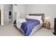 A calm, modern bedroom features soft carpet and a cozy, cushioned bed frame at 10721 E Pampa Ave, Mesa, AZ 85212