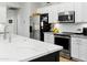 Bright kitchen with white subway tile backsplash, stainless steel appliances, and a modern range hood at 10721 E Pampa Ave, Mesa, AZ 85212