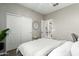 Serene bedroom featuring neutral tones, ample closet space, and a view into the adjoining room at 1153 E Muirwood Dr, Phoenix, AZ 85048