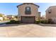 Front exterior showing a garage, mature landscaping and a porch overhang at 1153 E Muirwood Dr, Phoenix, AZ 85048