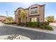 Two-story townhome with stone accents and tasteful landscaping, offering an inviting curb appeal at 1153 E Muirwood Dr, Phoenix, AZ 85048