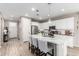 Beautiful kitchen featuring white cabinets, stainless appliances and breakfast bar with seating at 1153 E Muirwood Dr, Phoenix, AZ 85048