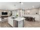 Open kitchen floor plan with stainless steel appliances and a breakfast bar at 1153 E Muirwood Dr, Phoenix, AZ 85048