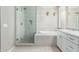 Modern main bathroom with a soaking tub, frameless shower and dual sink vanity at 1153 E Muirwood Dr, Phoenix, AZ 85048