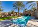 Community pool area with lounge chairs, bbq grill, and desert landscaping under a bright blue sky at 1153 E Muirwood Dr, Phoenix, AZ 85048