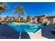 Community pool with lounge chairs and desert landscaping at 1153 E Muirwood Dr, Phoenix, AZ 85048