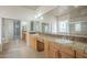 Luxurious en suite bathroom with double sinks, a soaking tub, a glass-enclosed shower, and ample counter space at 1154 E Kramer Cir, Mesa, AZ 85203