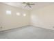 Bright bedroom with neutral carpet, recessed lighting, ceiling fan, and three windows with plantation shutters at 1154 E Kramer Cir, Mesa, AZ 85203