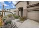 Front door and entrance of a home with a sidewalk and desert style landscaping in yard at 1154 E Kramer Cir, Mesa, AZ 85203