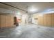 Three car garage offering parking and storage with shelving at 1154 E Kramer Cir, Mesa, AZ 85203
