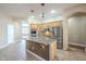 Kitchen featuring an island with a sink, tile flooring, and stainless steel appliances at 1154 E Kramer Cir, Mesa, AZ 85203