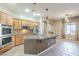 Gourmet kitchen with stainless steel appliances, granite countertops, and abundant cabinet space at 1154 E Kramer Cir, Mesa, AZ 85203