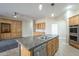 Spacious kitchen with granite countertops, stainless steel appliances, and ample cabinet space at 1154 E Kramer Cir, Mesa, AZ 85203