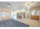 Spacious living room featuring tile floors, an open layout, and access to the kitchen at 1154 E Kramer Cir, Mesa, AZ 85203