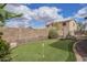 A well-manicured putting green enhances the backyard, offering a recreational feature for golf enthusiasts at 1154 E Kramer Cir, Mesa, AZ 85203
