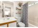 Well-lit bathroom with a decorative mirror and shower-tub combo at 12240 W Scotts Dr, El Mirage, AZ 85335