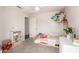 Cozy bedroom with a window, storage, and play area at 12240 W Scotts Dr, El Mirage, AZ 85335