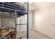 Bedroom featuring a loft bed, window, and closet at 12240 W Scotts Dr, El Mirage, AZ 85335