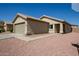Charming single-story home featuring a two-car garage, walkway, and low maintenance desert landscaping at 12240 W Scotts Dr, El Mirage, AZ 85335