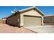 View of the two-car garage, featuring a DirectTV dish on the roof and low maintenance landscaping at 12240 W Scotts Dr, El Mirage, AZ 85335