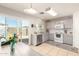 Well-lit kitchen featuring stainless steel appliances, neutral cabinets, and sliding glass doors at 12240 W Scotts Dr, El Mirage, AZ 85335
