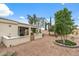 Expansive backyard featuring a covered patio and landscaped with desert landscaping at 12839 W Rincon Ct, Sun City West, AZ 85375