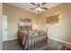 Bedroom featuring wood-look floors, ceiling fan, and comfortable furnishings ensuring a relaxing and stylish atmosphere at 12839 W Rincon Ct, Sun City West, AZ 85375