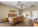 Bedroom with wood floors and adjoined bathroom and access to bath at 12839 W Rincon Ct, Sun City West, AZ 85375