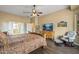 Cozy bedroom with wood floors and connected bathroom at 12839 W Rincon Ct, Sun City West, AZ 85375