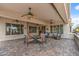Large, covered patio with ceiling fans features stylish furnishings for relaxed outdoor living at 12839 W Rincon Ct, Sun City West, AZ 85375