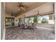 Comfortable covered patio with ceiling fans offers seamless indoor-outdoor living and dining spaces at 12839 W Rincon Ct, Sun City West, AZ 85375