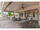 Inviting covered patio with ceiling fans provides ample seating and pleasant backyard views at 12839 W Rincon Ct, Sun City West, AZ 85375