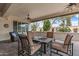 Inviting covered patio with comfortable seating and ceiling fans at 12839 W Rincon Ct, Sun City West, AZ 85375