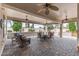 Spacious covered patio with ceiling fans and comfortable seating is perfect for outdoor entertaining at 12839 W Rincon Ct, Sun City West, AZ 85375
