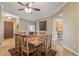 A dining room with rustic wooden table, chairs, and light fixture at 12839 W Rincon Ct, Sun City West, AZ 85375