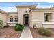 Charming home entrance with decorative plants, a walkway, and desert landscaping at 12839 W Rincon Ct, Sun City West, AZ 85375