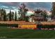 Community entrance sign surrounded by well manicured landscaping and a large fountain at 12839 W Rincon Ct, Sun City West, AZ 85375
