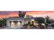 Beautiful single-story home with a landscaped front yard and a gray two-car garage at 12839 W Rincon Ct, Sun City West, AZ 85375