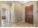 Inviting foyer with tile flooring, a large closet, and a view into other rooms at 12839 W Rincon Ct, Sun City West, AZ 85375