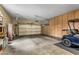 Spacious garage with ample storage cabinets and high ceilings provides secure parking at 12839 W Rincon Ct, Sun City West, AZ 85375