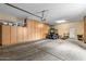 Bright, clean garage with abundant storage cabinets, perfect for organizing tools and equipment at 12839 W Rincon Ct, Sun City West, AZ 85375