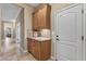Hallway cabinet with granite counters offers extra storage and style for added convenience at 12839 W Rincon Ct, Sun City West, AZ 85375