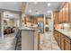 An open kitchen featuring wood cabinets, granite countertops, and stainless steel appliances at 12839 W Rincon Ct, Sun City West, AZ 85375
